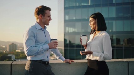 Enjoying coffee conversation on a rooftop at sunset in a bustling city skyline - Powered by Adobe