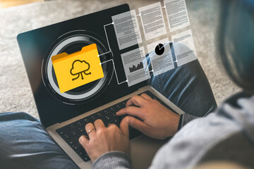 Remote Worker Managing Digital Documents and Cloud Storage Files, Highlighting Data Organization and Online Archiving System