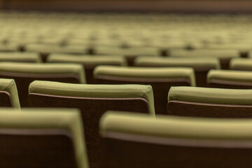 Closeup of seats in audience hall empty. Performing arts and theatre entertainment venue