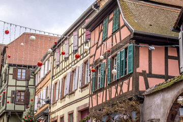 Typical half-timbered houses decorated for Christmas in Riquewihr, Alsace, France