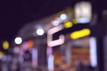 Night city lights blurry texture. Abstract night city defocused street background of Shawan town in...