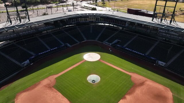 Aerial view of a baseball field, Sloan Park, showcasing vibrant green grass and clay contrasted against the stadium seating, Mesa, Arizona, United States.