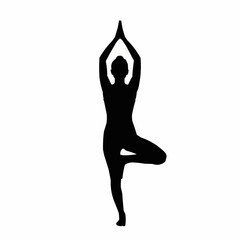 Fototapeta premium Silhouette of a woman in a yoga tree pose, balancing and focused.