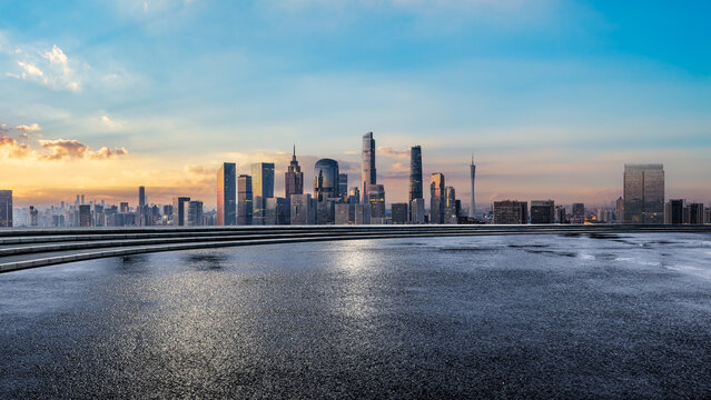 Empty asphalt road and modern city skyline with commercial buildings at beautiful sunrise in Guangzhou - Powered by Adobe
