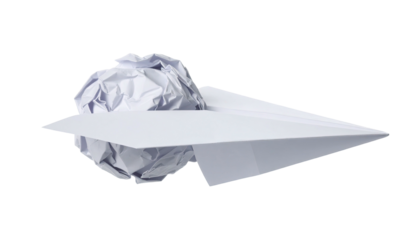 A crisp white paper airplane next to a wad of crumpled paper. Idea, fail, contrast