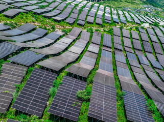 A large solar power station on the green mountain slopes