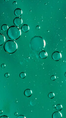 oil drops on water on blue background