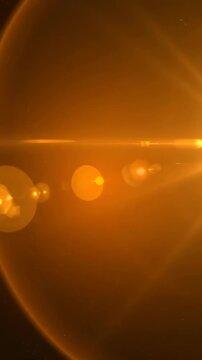 Cinematic slow pan across a deep amber background featuring large, intense lens flares that leave subtle golden afterglow effects and light persistence trails light, film, texture