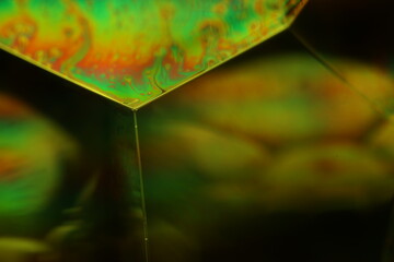 Green liquid chemical surface, phenomenal structure, green oils on a dark background, colourful abstract, surrealistic art, iridescent effect