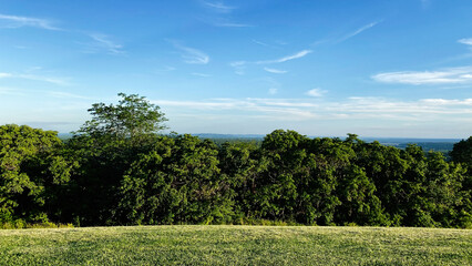 Naklejka premium Forest Hillside Landscape Under a Clear Blue Sky in Southern Illinois USA