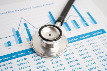 Stethoscope on chart or graph paper, Financial, account, statistics and business data medical health.