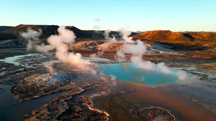 Dynamic flyover capturing the intricate patterns of a geothermal hot spring, showcasing vibrant mineral deposits and steam vents from high above. Wide angle, high altitude shot with slow forward? - Powered by Adobe