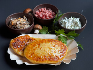 Ukrainian Potato Patties with Mushroom Filling on Dark Background