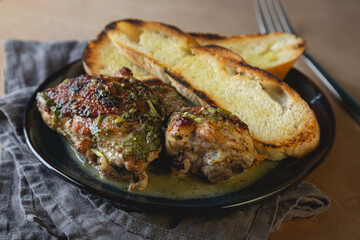 Baked chicken pieces in a creamy sauce with aromatic herbs