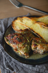 Baked chicken pieces in a creamy sauce with aromatic herbs