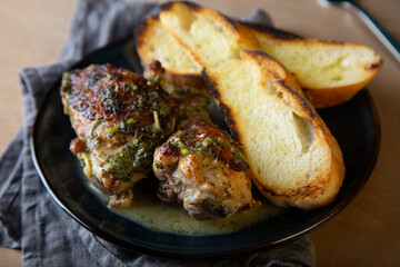 Baked chicken pieces in a creamy sauce with aromatic herbs