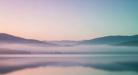 Obraz premium Serene Early Morning Lake Scene with Mist-Hazed Mountains and Soft Pastel Sky