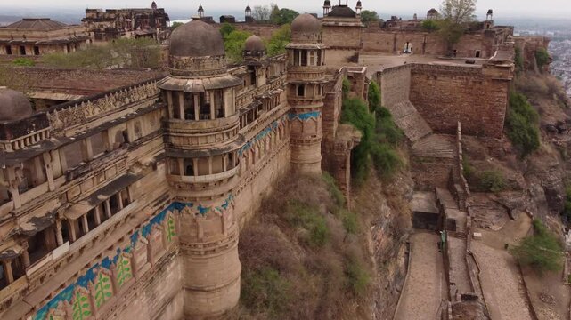Aerial view of the majestic Gwalior Fort, showcasing its detailed architecture and the rugged landscape, Gwalior, Madhya Pradesh, India.