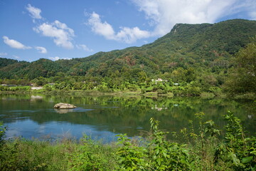 Fototapeta premium Forested Hills and River Rock