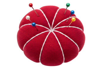 Red sewing pincushion with multiple colorful pins for tailoring isolated on transparent background