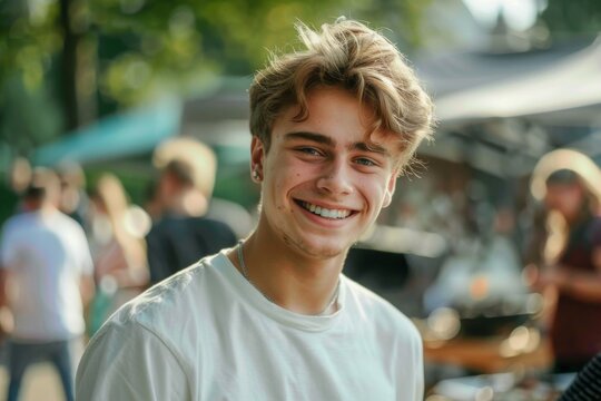 Young man smiling happily at a market