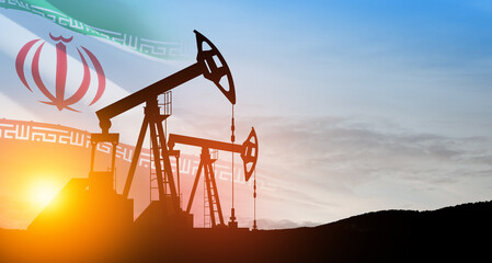 Oil drilling derricks at desert oilfield with Iran flag. The change in oil prices caused by the war. Oil prices are rising because of the global crisis. Crude oil production from the ground.