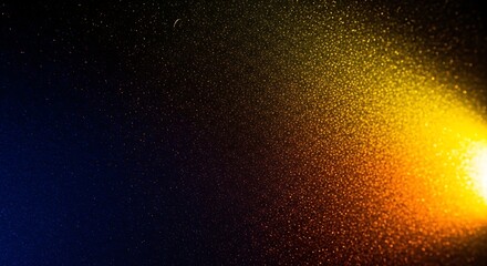 An energetic burst of golden yellow and cool blue light particles creating a dynamic abstract texture on a dark, mysterious background