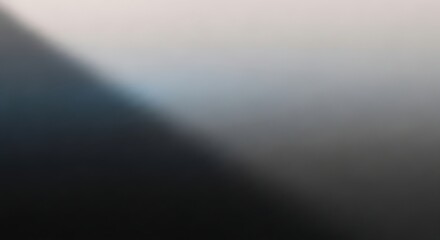 A modern and minimalist abstract background featuring a soft diagonal gradient that separates deep shadow from gentle light, creating a simple and clean design element