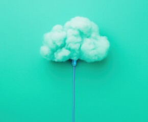 Soft Cloud with Electrical Cord on Vibrant Teal Background