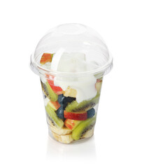 Tasty fruit salad with yogurt in plastic cup isolated on white