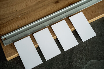 Business card mockup on wooden boards and stone surface
