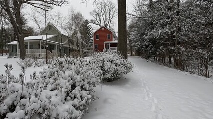 front yard and red house covered with snow in January - Powered by Adobe