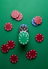 Poker chips on green table for casino nights and gaming enthusiasts