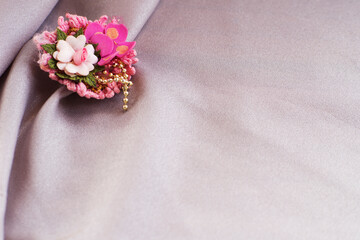 textile Background with Handmade Flower Decoration