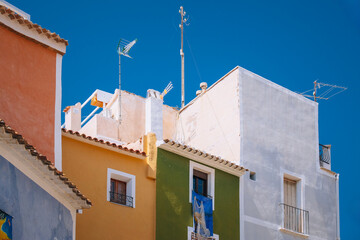 View to beautiful Villajoyosa old town with typical colorful houses and rooftops in sunny day