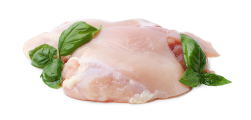 Raw chicken thighs with basil isolated on white