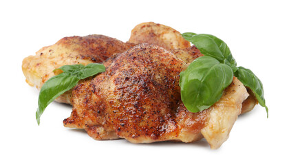 Tasty roasted chicken thighs with basil isolated on white