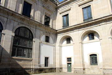 Obraz premium Corner of El Escorial monastery in Spain under clear blue sky, July 2024