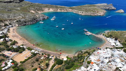 Fototapeta premium Aerial drone photo of paradise organized main beach of Lindos with amazing turquoise waters, Rhodes island, Dodecanese, Greece
