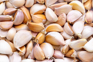 Close-up macro photography of garlic,Full frame close-up macro photography of garlic,Garlic, head in a close-up cut, background with garlic texture. Macro photography. High quality photo