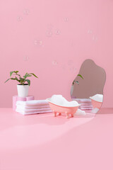 Pink miniature bathtub in pink bathroom with bubble