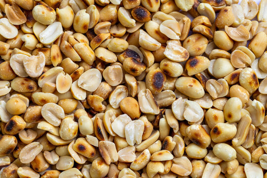 Close-up macro of roasted peanuts,Close up of roasted peanuts background,Roasted and salted peanuts, snack food, background, from above 