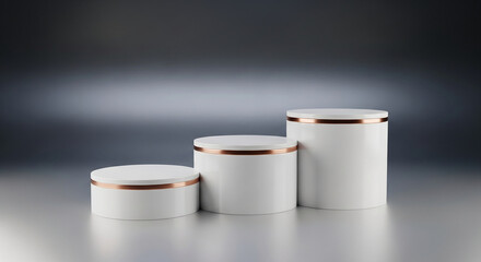 Three cylindrical white pedestals with copper band detail, in ascending height, on gradient grey surface, creating display showcase presentation
