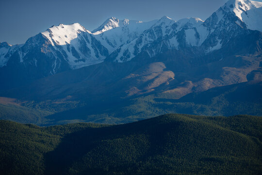 Majestic snow-capped Altay mountain range under clear blue sky at sunrise - Powered by Adobe
