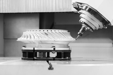 Closeup arm axis CNC machining center cutting engine iron blade turbine for industry