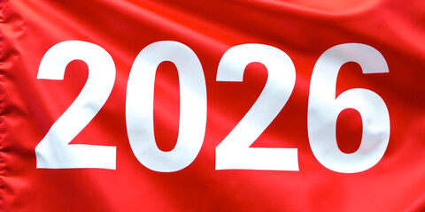 White numbers 2026 as a symbol of the New year on a red waving flag texture background. Banner with copy space