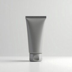 Gray cream tube with round cap cosmetic product mockup blank beauty container simple skincare packaging design gray monochrome product photography