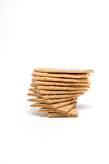 Airy crackers stacked on top of each other, vertical image with a white background.