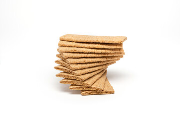 Airy crackers stacked on top of each other, horizontal  image with a white background.