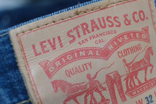 A close-up of the Levi Strauss brand tag on blue jeans. Shopping concept. For editorial use only, demonstrating quality and brand identity. Russia, Moscow, November 1, 2025.